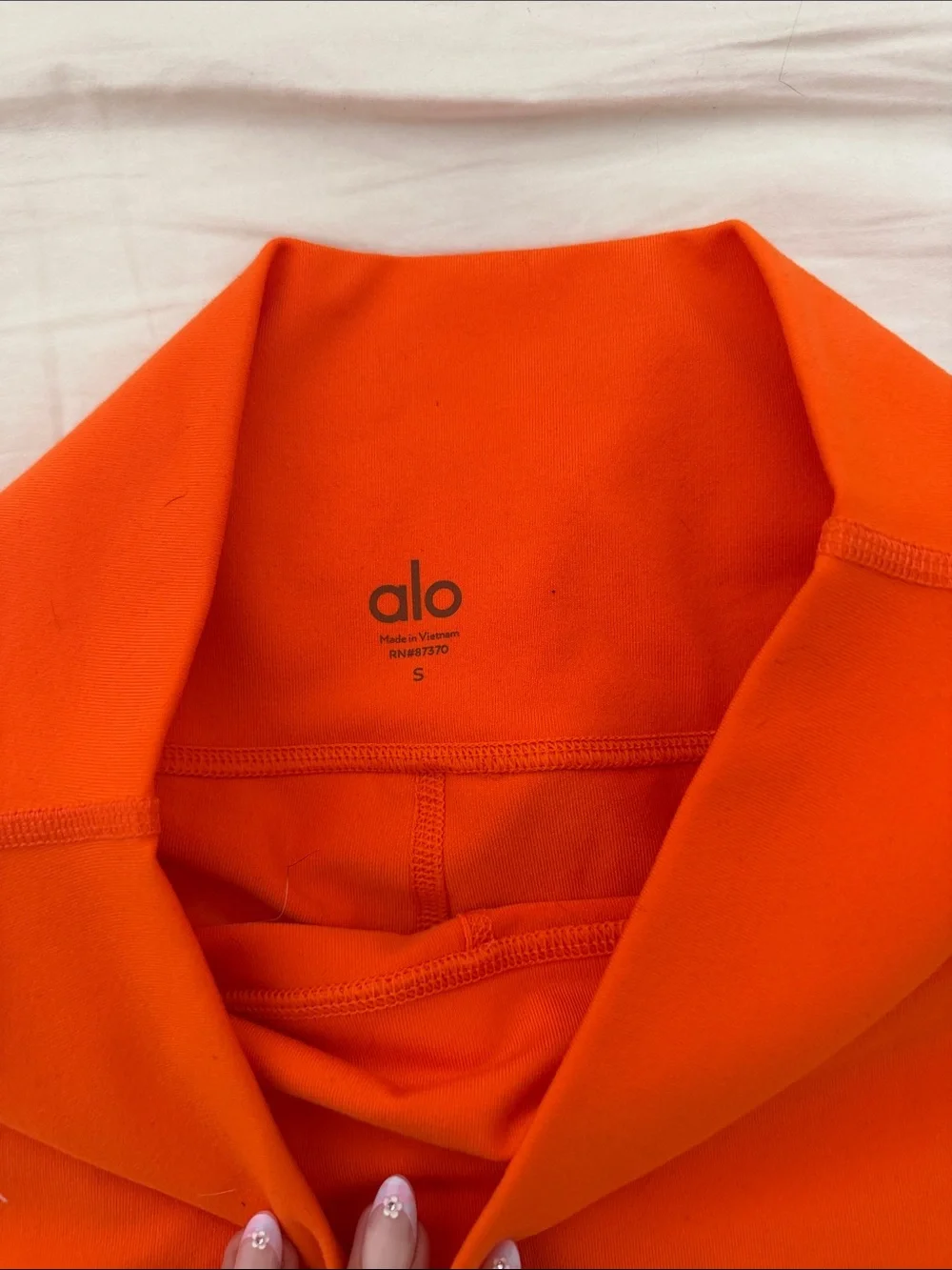 ALO Yoga Orange High-Rise Bike Shorts with Dark Stripe Detail